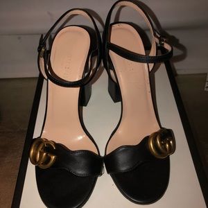 Black Gucci heels.